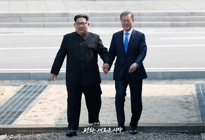 Two Korean leaders walk across DMZ, declare end of war